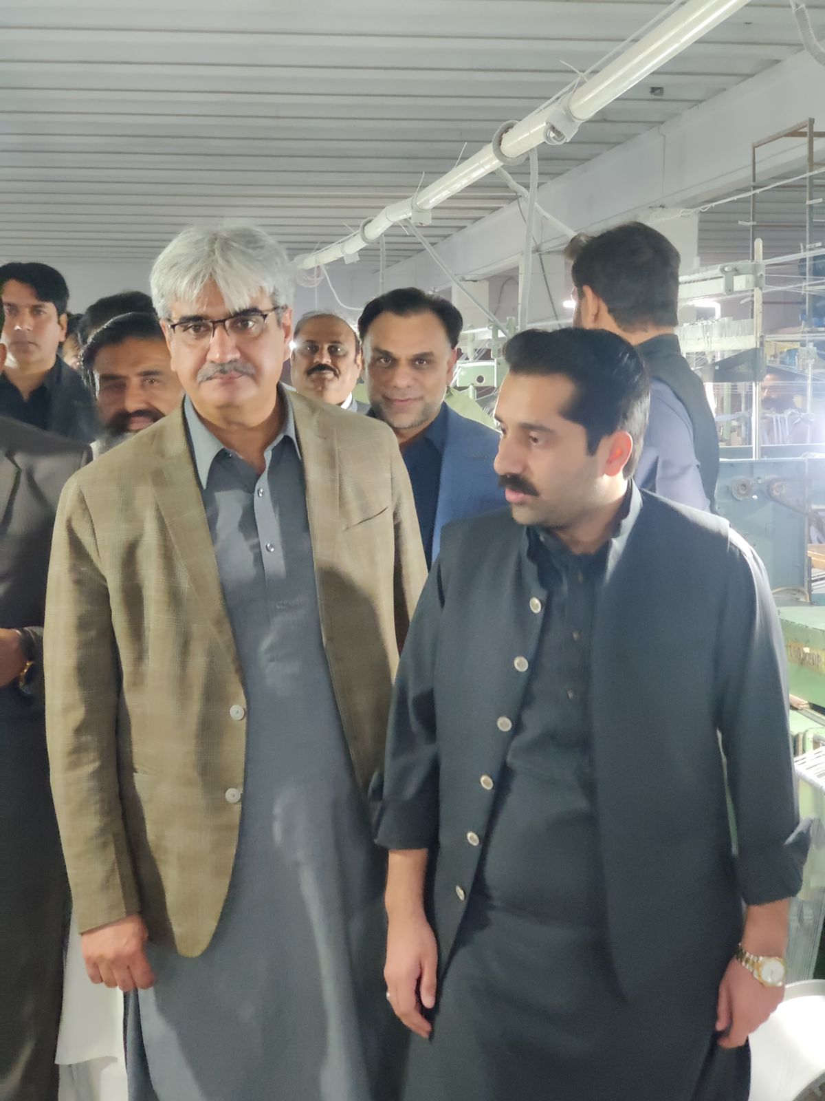 Distinguished guests touring the factory floor